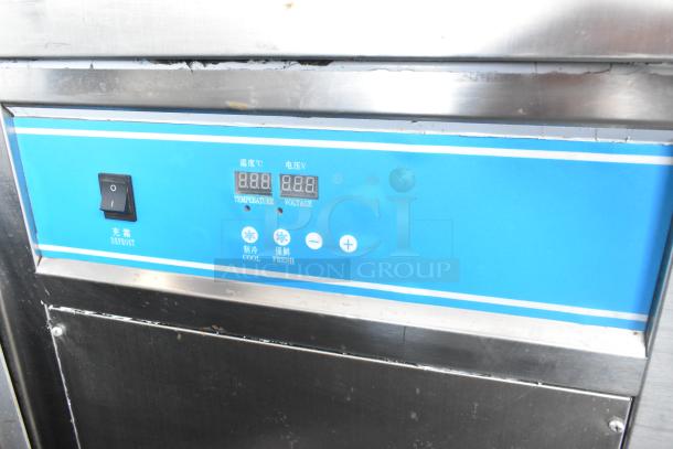 Stainless steel ice cream station with digital display, labeled "Temperature" and "Voltage." Runs on 115 volts, 1 phase.