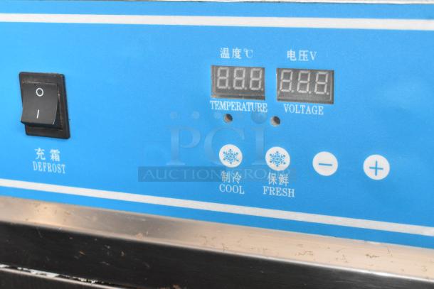 Stainless steel commercial rolled ice cream station control panel with settings for temperature, voltage, cool, fresh, and defrost.