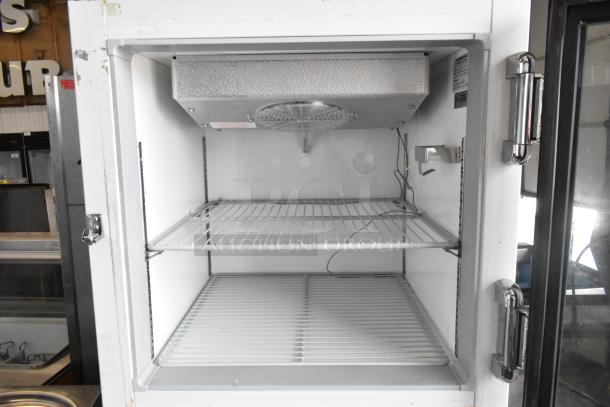 GEM CTR Metal Mini Cooler Merchandiser, 115 Volts, 1 Phase, white interior, two wire shelves, good condition.