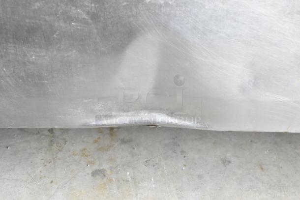 True TRCB-72 stainless steel chef base, dent in front, on commercial casters. 115 volts, 1 phase, 4 drawers.