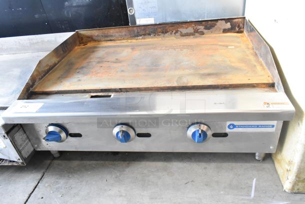 Standard Range SR-G36-M stainless steel commercial gas griddle; flat top, worn surface, three control knobs, used condition.