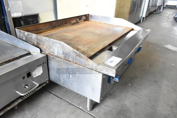 Standard Range SR-G36-M stainless steel flat top griddle, natural gas-powered, commercial use, visible wear, model tag present.