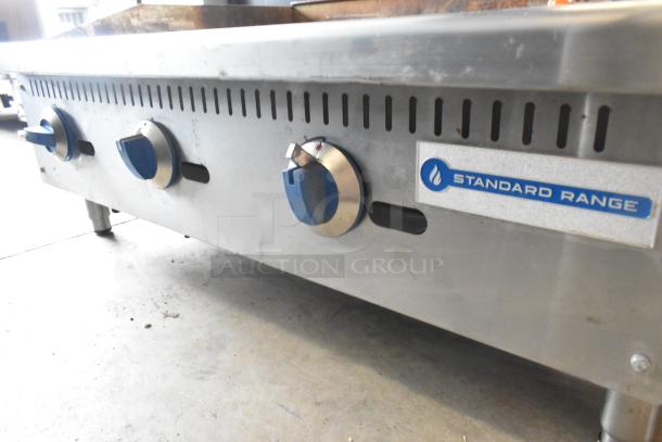 Standard Range SR-G36-M stainless steel countertop griddle, natural gas, three control knobs, visible brand logo.