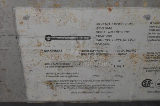 Standard Range SR-G36-M griddle tag showing model, serial number 210423099, natural gas type. Slight surface rust present.