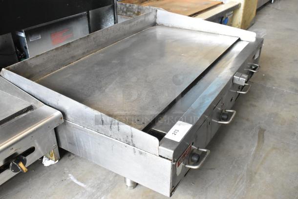 Vulcan 48RPG-E stainless steel commercial countertop natural gas flat top griddle, used condition, visible knobs and markings.