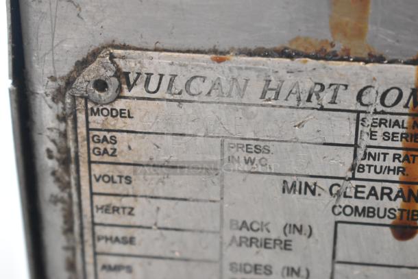 Vulcan 48RPG-E stainless steel griddle label, showing model and gas specs. Slight wear and rust on the edges.