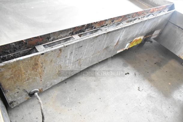 Vulcan 48RPG-E stainless steel commercial flat top griddle, natural gas, countertop model, visible wear and rust.