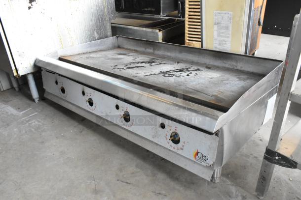 Cooking Performance Group stainless steel gas flat top griddle, commercial countertop, visible wear, CPG branding, manual controls.