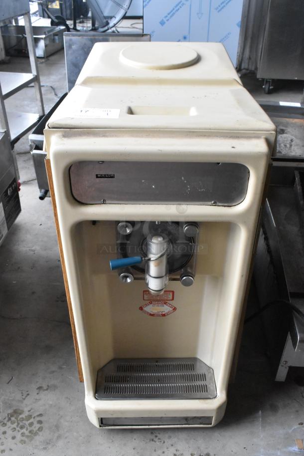 Taylor 450-12 single flavor frozen beverage machine, metal, commercial countertop model, 115V, 1 phase, visible wear.