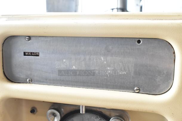 Taylor 450-12 frozen beverage machine, metal body, “MIX LOW” indicator visible, 115 volts, 1 phase, commercial use.