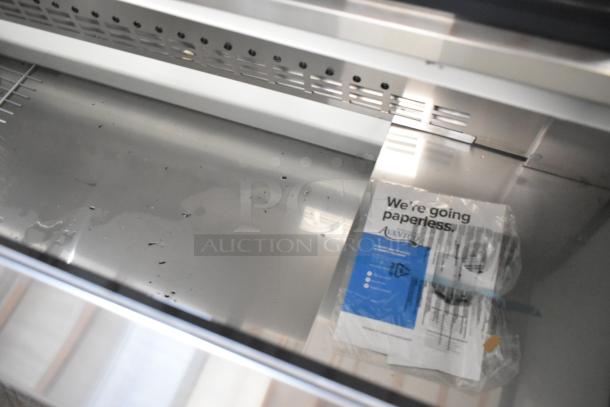 Brand new 2024 Avantco 178HBB95HC, 95" black horizontal bottle cooler, metal finish, 115V, 1 Phase, slight scratching visible.