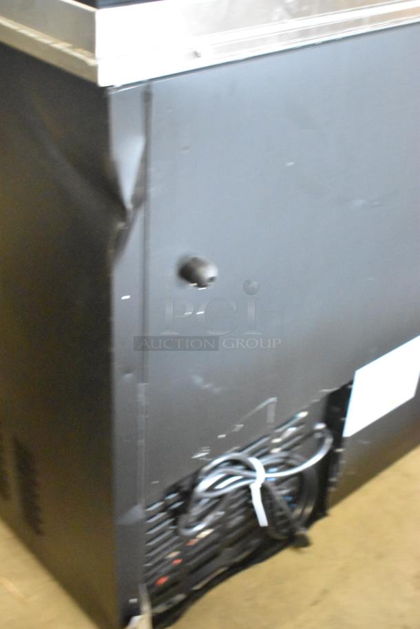 BRAND NEW Avantco 178HBB95HC 95" black bottle cooler, 115V, with visible scratches and dents on the side panel.