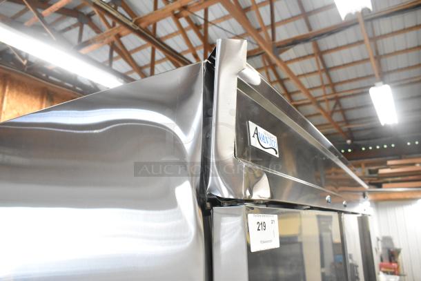 Brand new Avantco 178SS3FHC stainless steel commercial cooler with dents, 3-door, poly-coated racks, on casters.