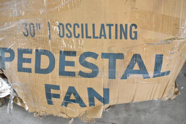 Brand new Boltic 30" oscillating pedestal fan in original packaging; box shows signs of wear with scratches and dents.