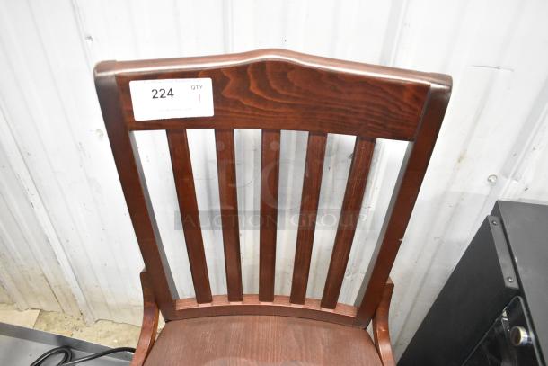 Brand new wooden dining height chair with minor scratches. Rich wood finish, vertical slat backrest. Auction tag: "224 QTY."