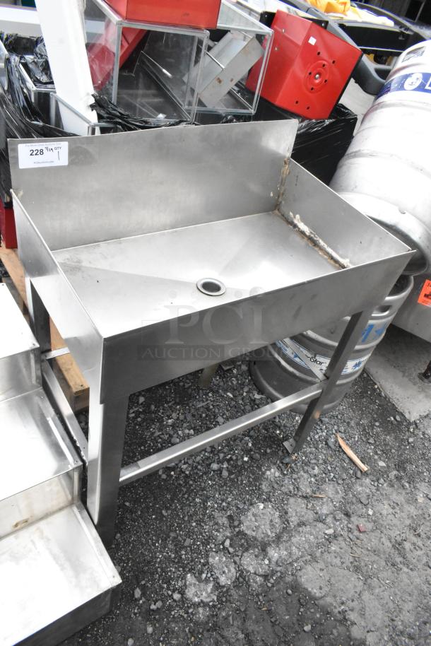 Metal ice bin table with drainage hole, sturdy legs, and some visible wear. Suitable for catering or bars. Auction item 228.