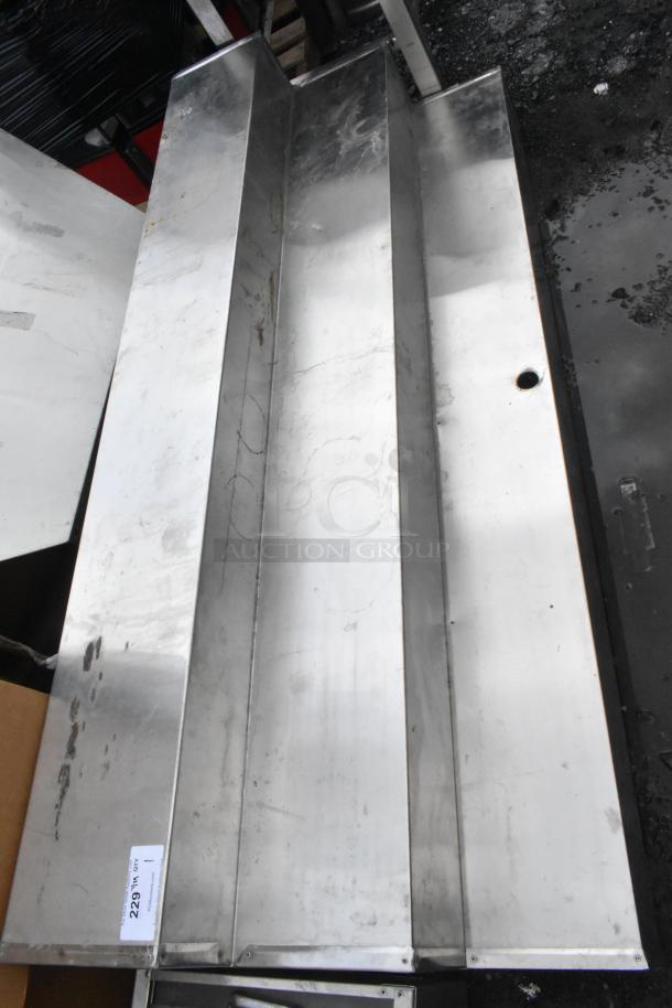 Metal 3 Tier Display with a polished surface, showing minor scratches and signs of use. Tag "229141 QTY 1" visible.