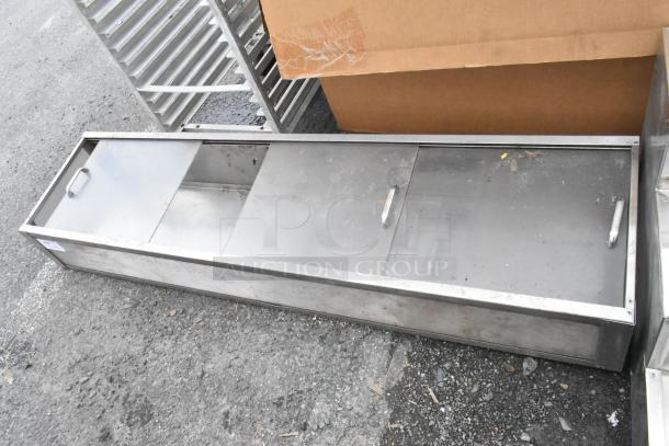 Metal cabinet with clear doors, featuring two sliding sections and handles. Appears in used condition; suitable for storage.