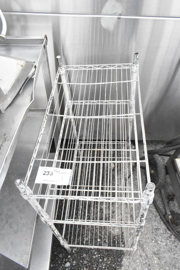 Chrome finish 3-tier wire shelving unit, showing wear. Includes auction tag with lot number 233. Buyer dismantles.