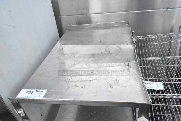 Metal 3 tier cart on commercial casters, slightly worn surface, visible auction label "235," from PCAuctions.com.