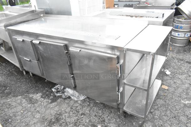 Stainless steel commercial undercounter cooler with 2 doors and 2 drawers, used condition, ideal for restaurant kitchens.