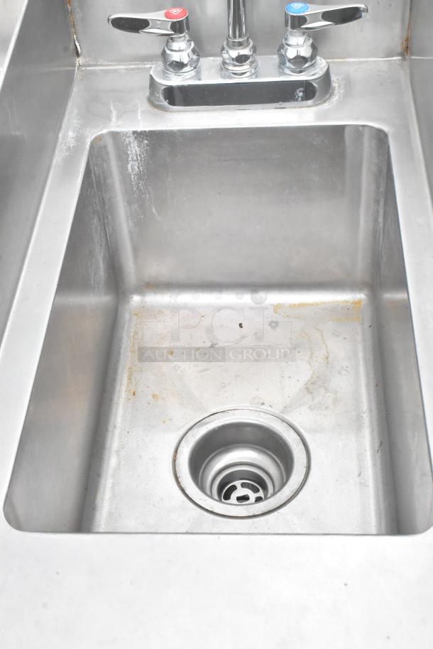Atlas Metal stainless steel commercial ice bin with right side single sink bay, some surface wear, includes dual-handle faucet.