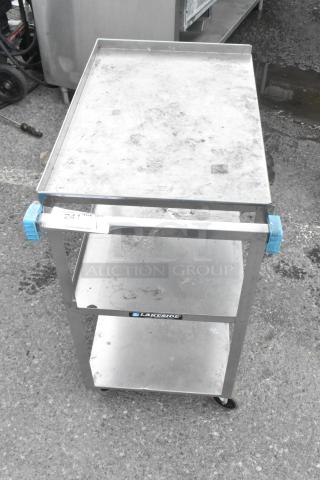 Lakeside Metal 3 Tier Cart with commercial casters. Shows visible wear. Features robust shelving and mobility.
