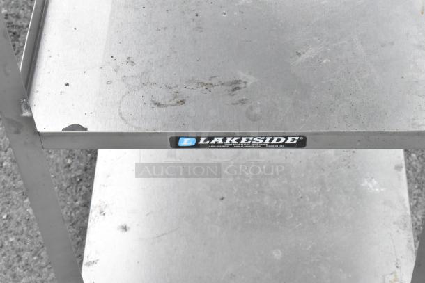 Lakeside metal 3-tier cart with commercial casters, showing mild scuffs and label indicating brand. Durable and mobile.