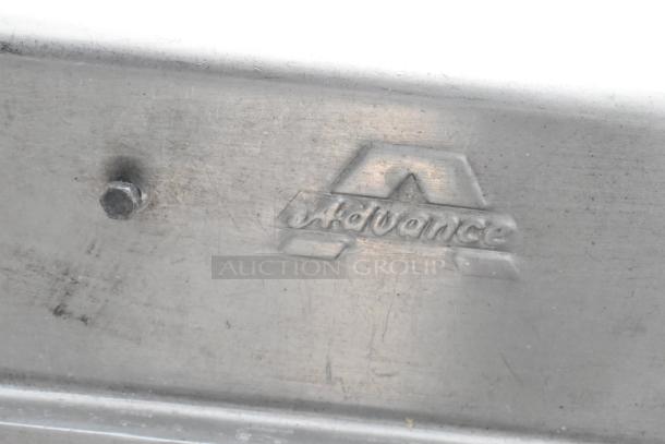Stainless Steel 2 Bay Sink with dual drain boards, embossed "Advance" marking, no legs included.