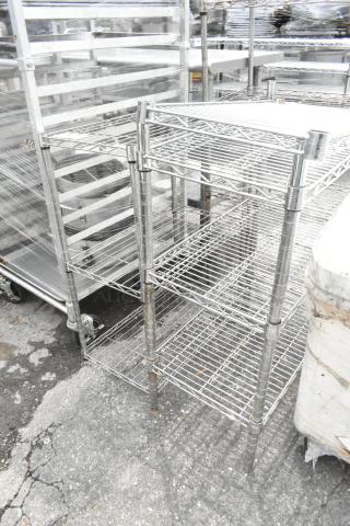 Two chrome finish 3-tier wire shelving units, each measuring 24x14x34 inches, in good condition.