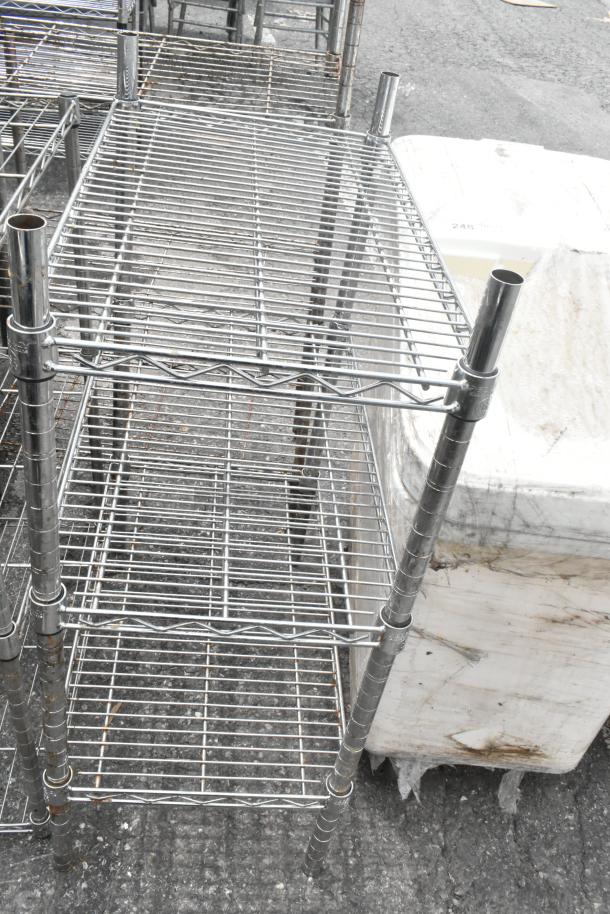 2 chrome finish 3-tier wire shelving units, measuring 24x14x34 inches each. Durable, multipurpose storage solution.