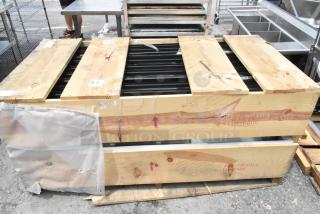 Brand new crate containing ten 23-1/8"x60" glass doors. Crate marked "GLASS-HANDLE WITH CARE" for protection.