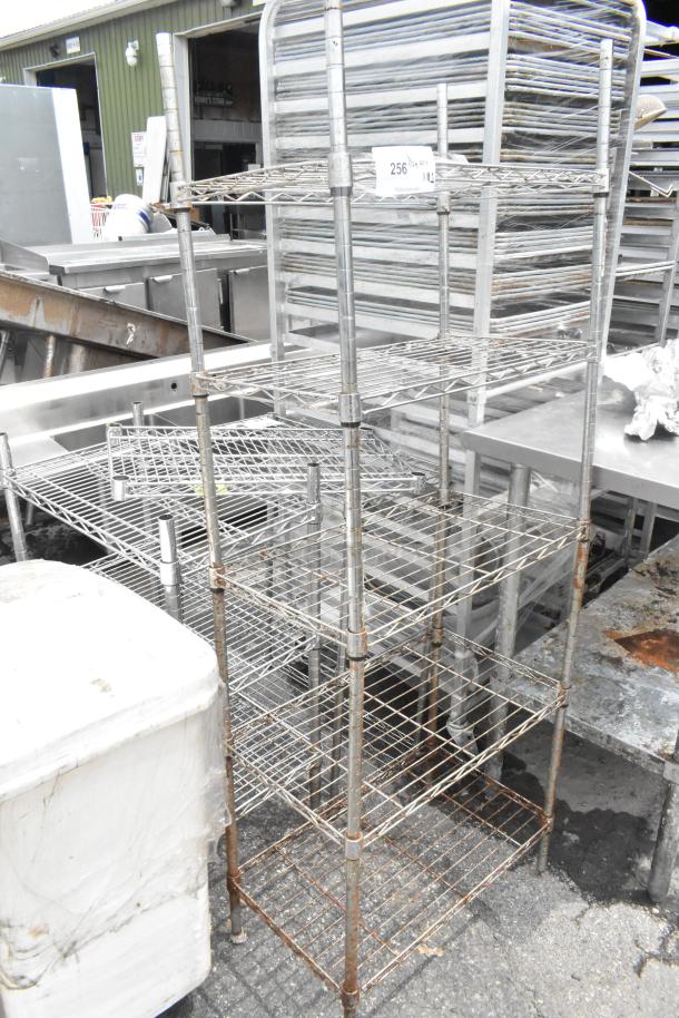 Chrome finish 5 tier wire shelving unit, visible wear, buyer dismantles. Consider freight charges.