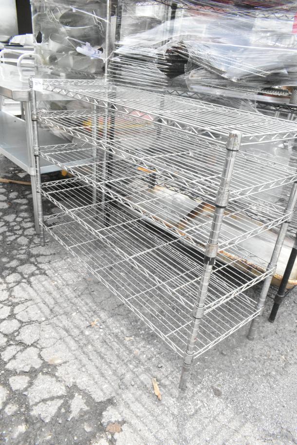 Chrome finish, 5-tier wire shelving unit, sturdy construction. Buyer must dismantle; consider freight charges.