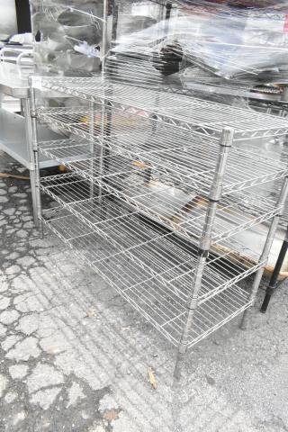 Chrome finish, 5-tier wire shelving unit, sturdy construction. Buyer must dismantle; consider freight charges.