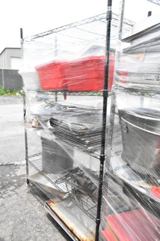 Black finish 4-tier wire shelving unit with utensils, rolling pin, and metal baking pans. Buyer must dismantle.