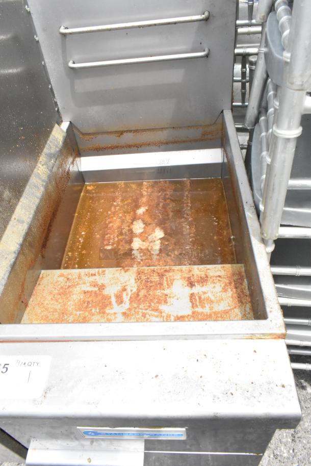 Standard Range SR-F4-NG stainless steel commercial deep fat fryer. Natural gas powered, 120,000 BTU, visibly rusted interior.