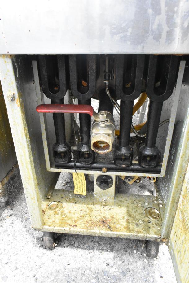 Standard Range SR-F4-NG stainless steel natural gas fryer, 120,000 BTU, floor style. Visible control dial and gas valve. Used condition.