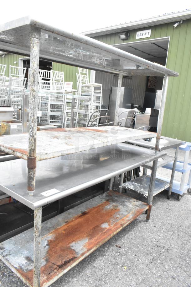 Two stainless steel tables with metal under shelves, dimensions 72x30x35 inches, showing signs of rust and wear.