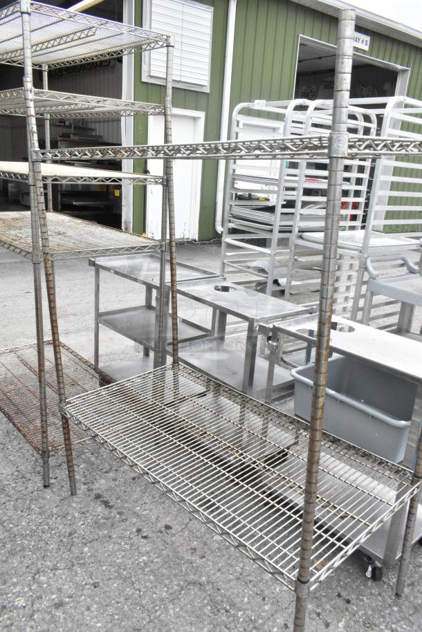 Two chrome-finish wire shelving units, 48x24x72.5 inches. Buyer must dismantle. Suitable for garage or warehouse storage.