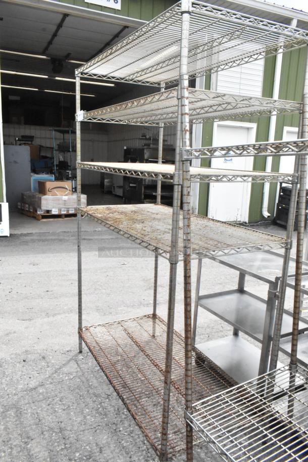 2 chrome finish wire shelving units, dimensions 48x24x72.5 inches. Buyer must dismantle. Visible wear and rust.