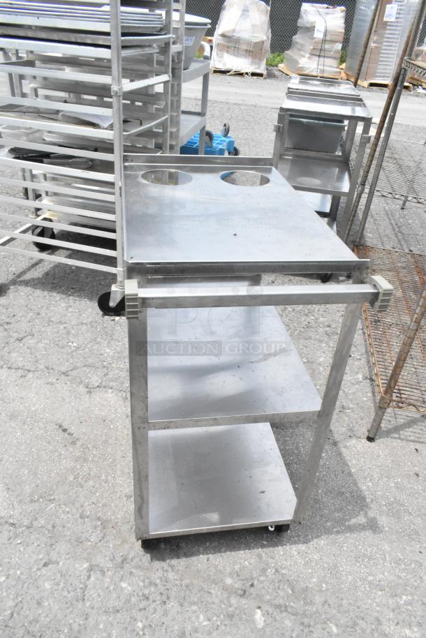 Three stainless steel 3-tier carts with commercial casters, featuring side handles and durable construction, good condition.