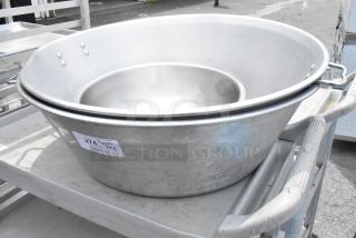 Three nested metal bowls, largest 29x29x9 inches. Includes auction tag with item number 274, indicating 3 bidding times.