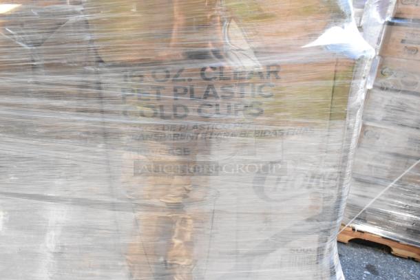 Pallet wrapped in plastic showing boxes of 16 oz. clear PET plastic cold cups. Brand new condition.