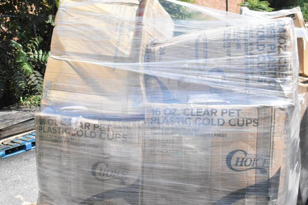 Pallet of boxes labeled "16 oz. Clear PET Plastic Cold Cups" wrapped in plastic. Contains plasticware, gloves, scratch and dent items.