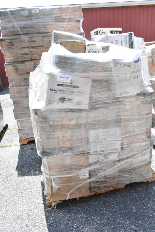 A stack of pallets with various brand new scratch and dent items including to-go containers, paper towels, hot cups, napkins, and disposable plates, wrapped in plastic.