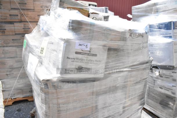 Pallet of brand new scratch and dent items including cutlery packs, paper towels, hot cups, napkins, and disposable plates.