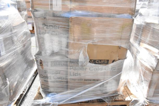Plastic-wrapped pallets with boxes labeled "Paper Cold Cup Lids." Contains scratch and dent items like containers and towels.