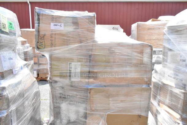 Wrapped pallets of assorted brand new scratch and dent items including containers, towels, and gloves. Visible labels on boxes.