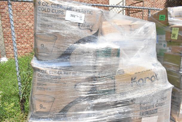 Pallet of assorted packaged goods, including marked 9 oz cold cups and Kondi yogurt cups, wrapped in plastic. Auction lot 302.